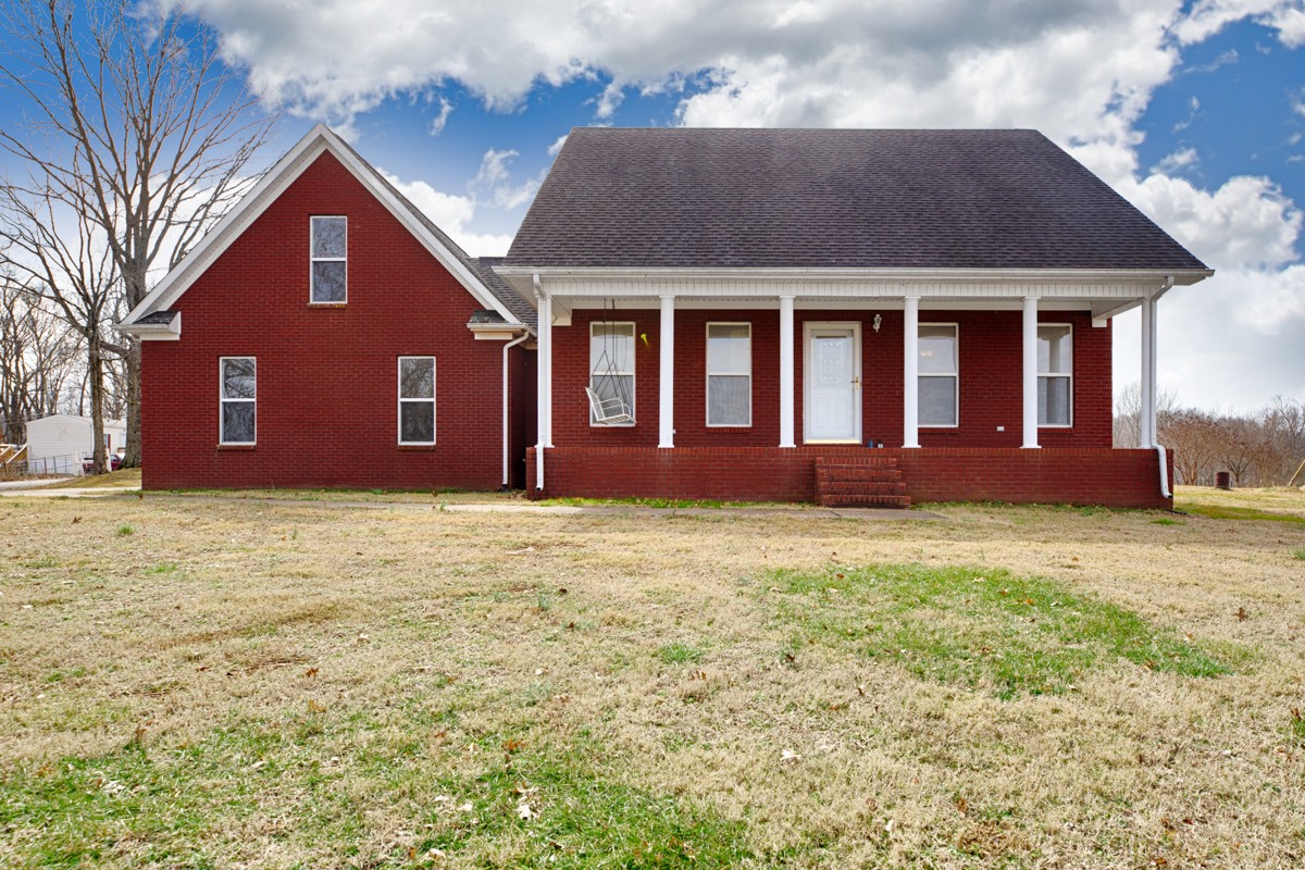 168 Lake Logan Road Ardmore, TN 38449 - Photo 22 of 27 a front view of a house with a garden