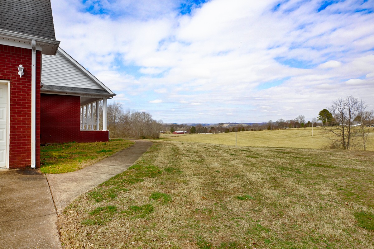 168 Lake Logan Road Ardmore, TN 38449 - Photo 24 of 27 a view of a house with a yard