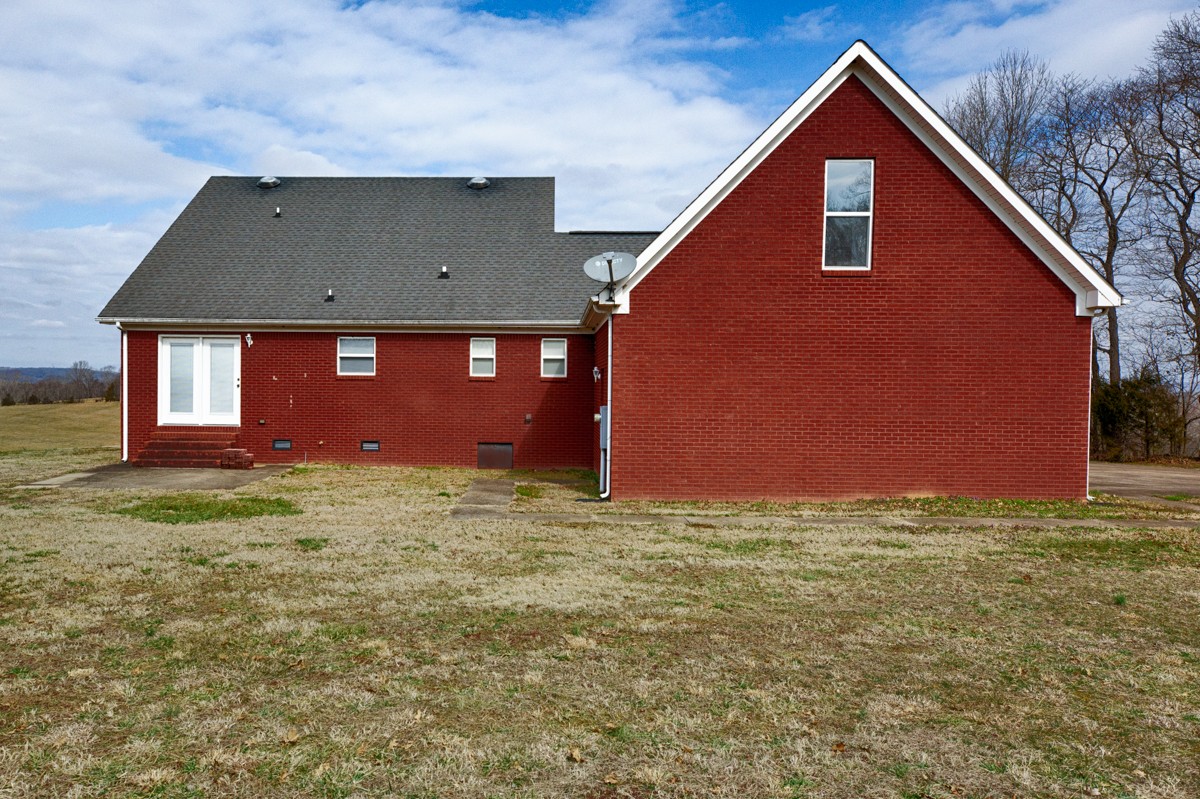 168 Lake Logan Road Ardmore, TN 38449 - Photo 25 of 27 a view of a house with a yard
