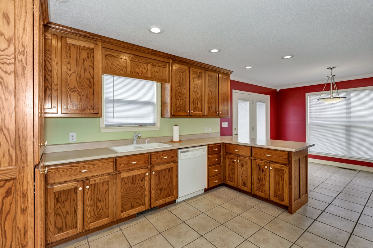 168 Lake Logan Road Ardmore, TN 38449 - Photo 8 of 27 a kitchen with stainless steel appliances granite countertop a sink and cabinets