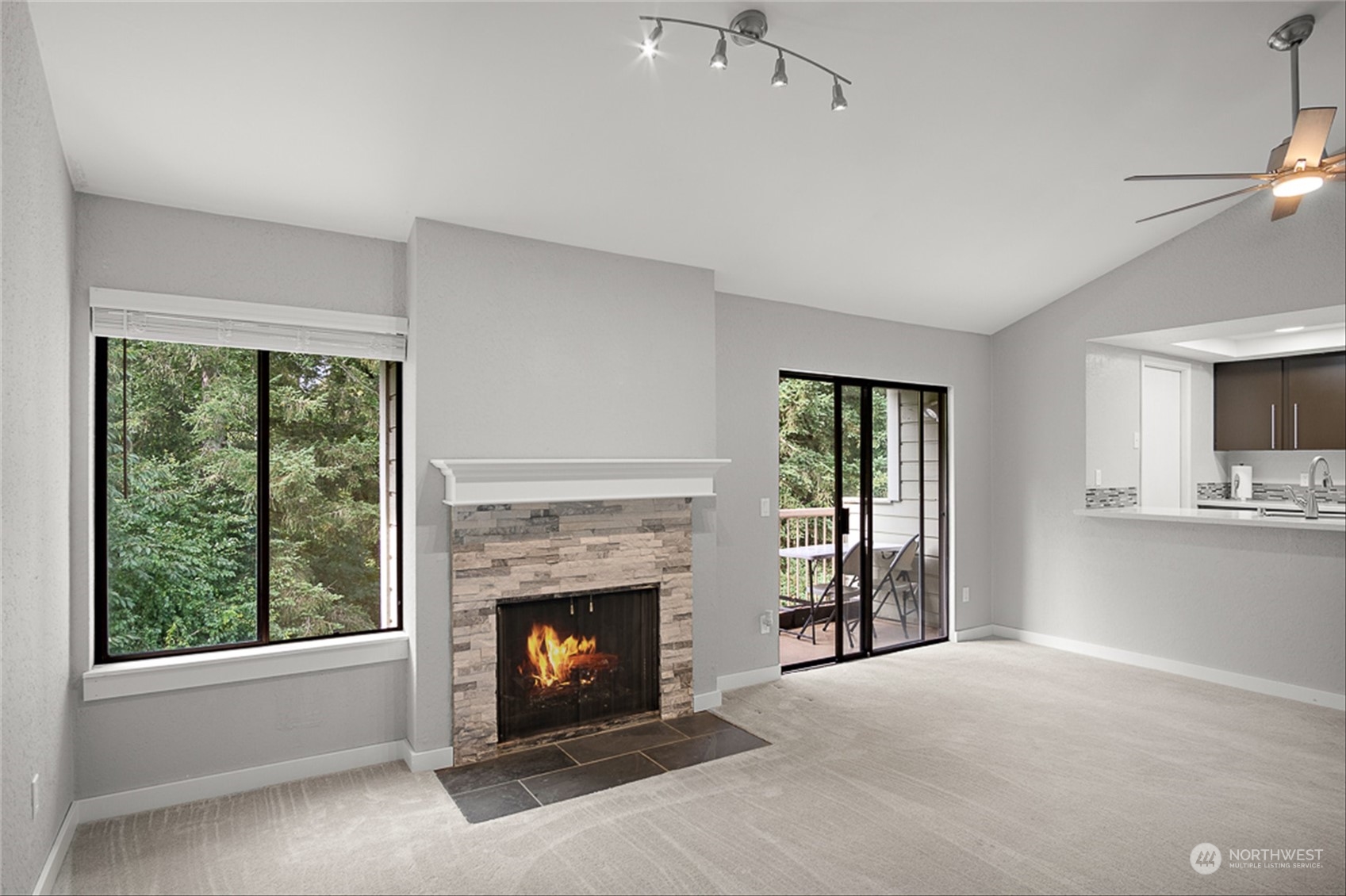 14401 Southeast Petrovitsky Road, Unit E202 Renton, WA 98058 - Photo 11 of 26 a living room with furniture and a fireplace