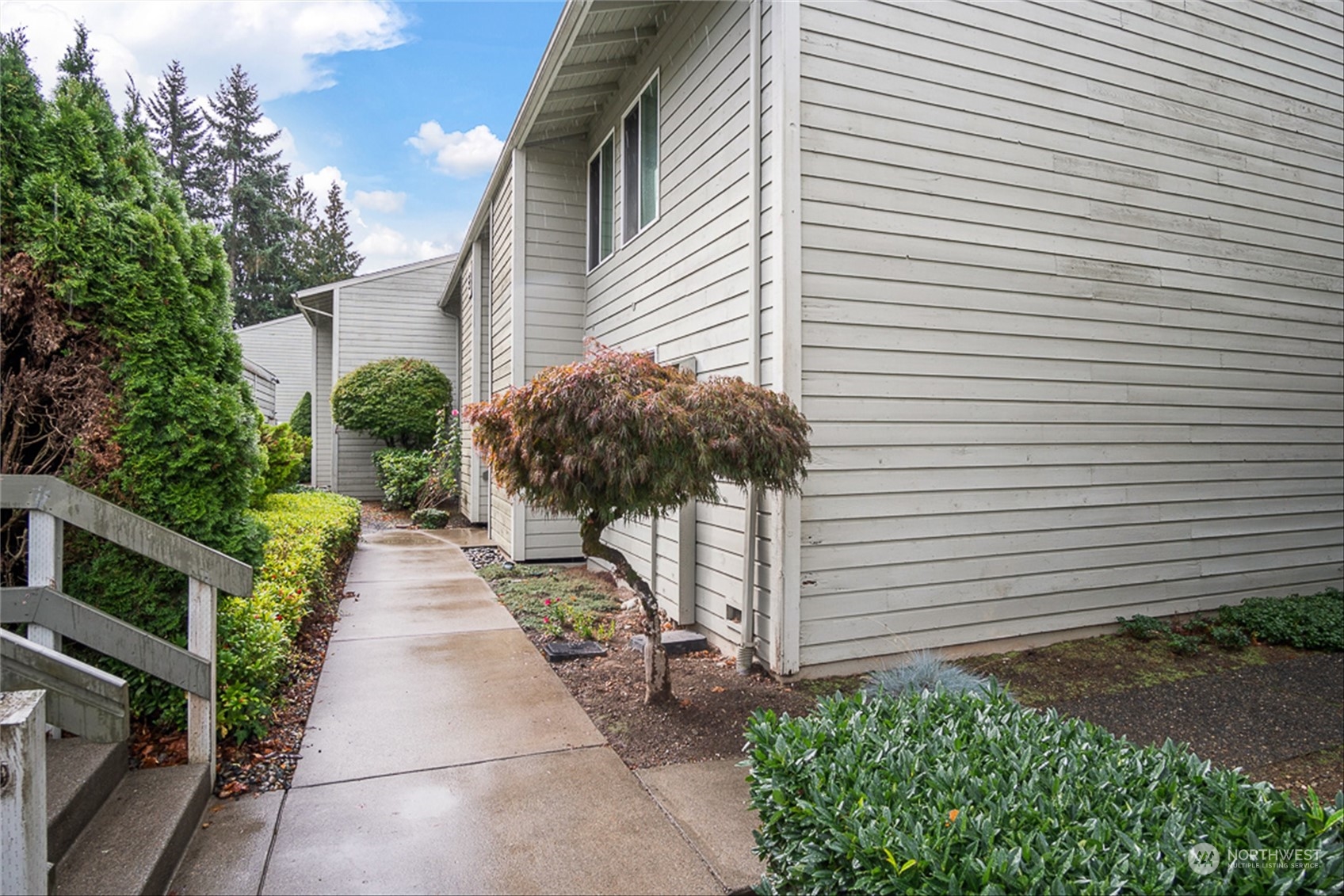 14401 Southeast Petrovitsky Road, Unit E202 Renton, WA 98058 - Photo 4 of 26 a view of a pathway with a house