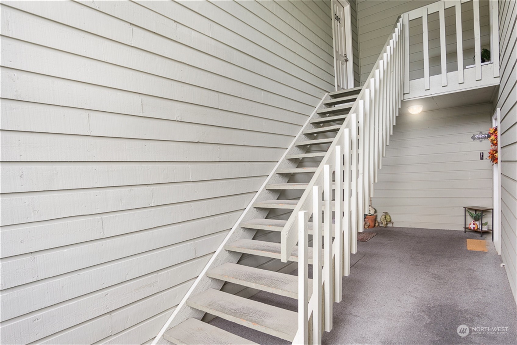 14401 Southeast Petrovitsky Road, Unit E202 Renton, WA 98058 - Photo 6 of 26 a view of entryway with stairs