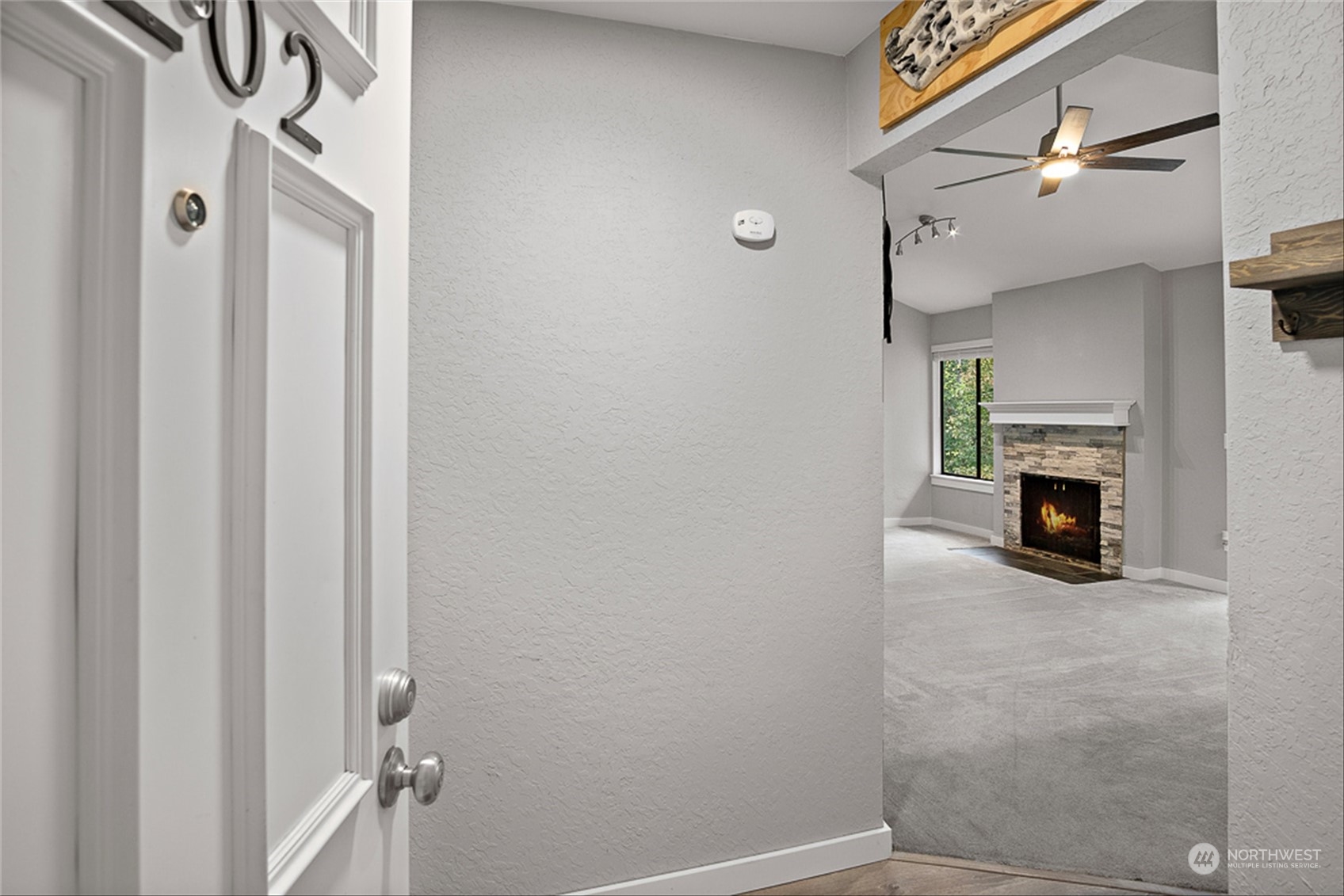 14401 Southeast Petrovitsky Road, Unit E202 Renton, WA 98058 - Photo 8 of 26 a view of a livingroom with a fireplace