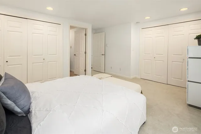 a bedroom with a bed and a shower