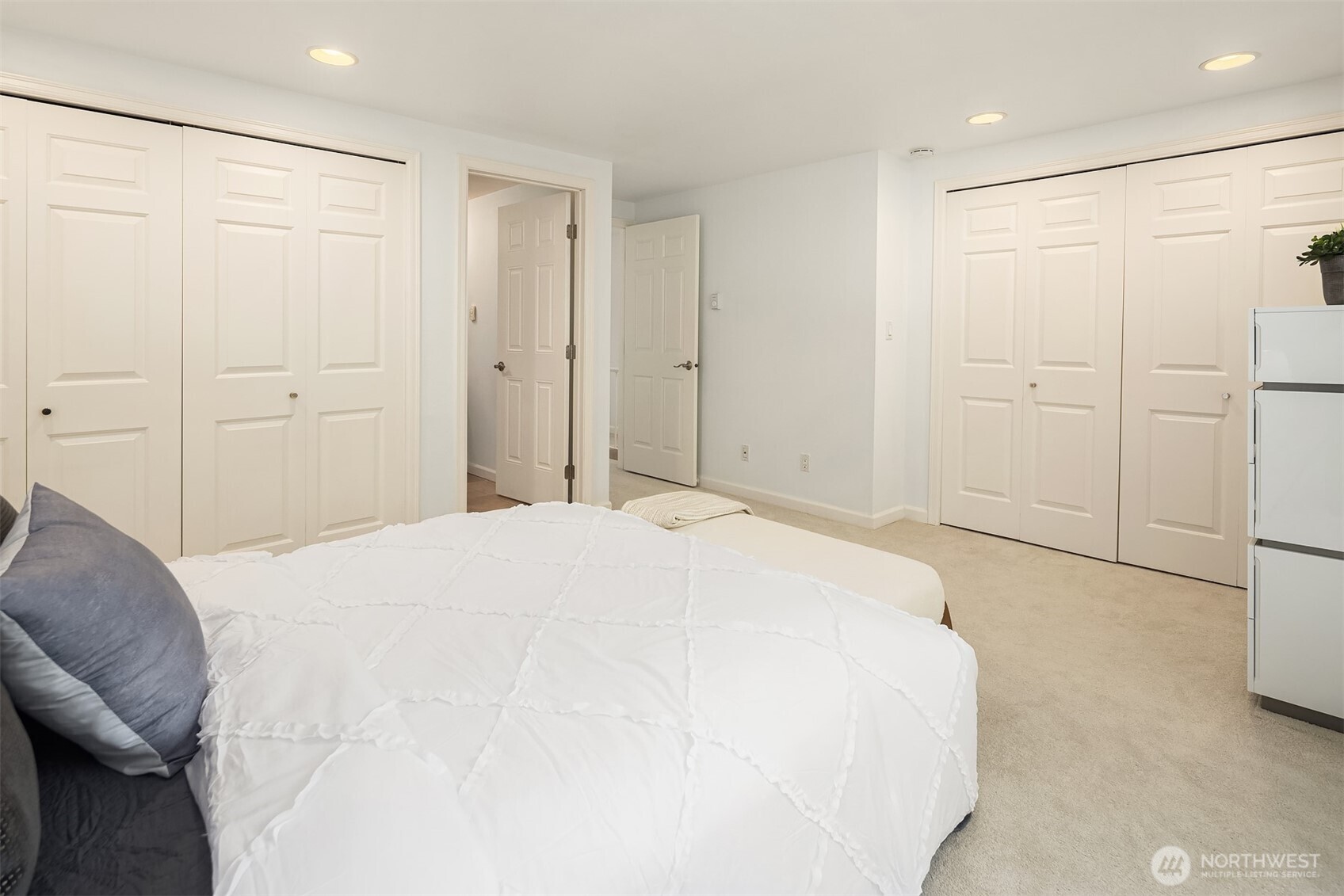 379 100th Avenue Northeast, Unit A Bellevue, WA 98004 - Photo 18 of 38 a bedroom with a bed and a shower