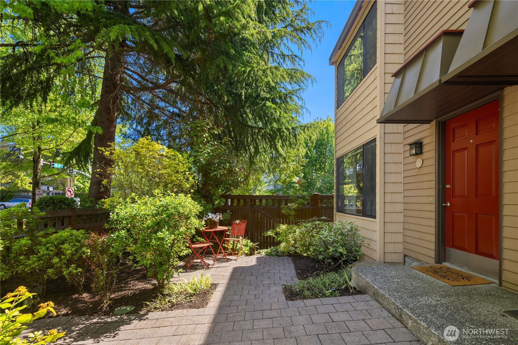379 100th Avenue Northeast, Unit A Bellevue, WA 98004 - Photo 2 of 38 a bunch of flowers in front of house
