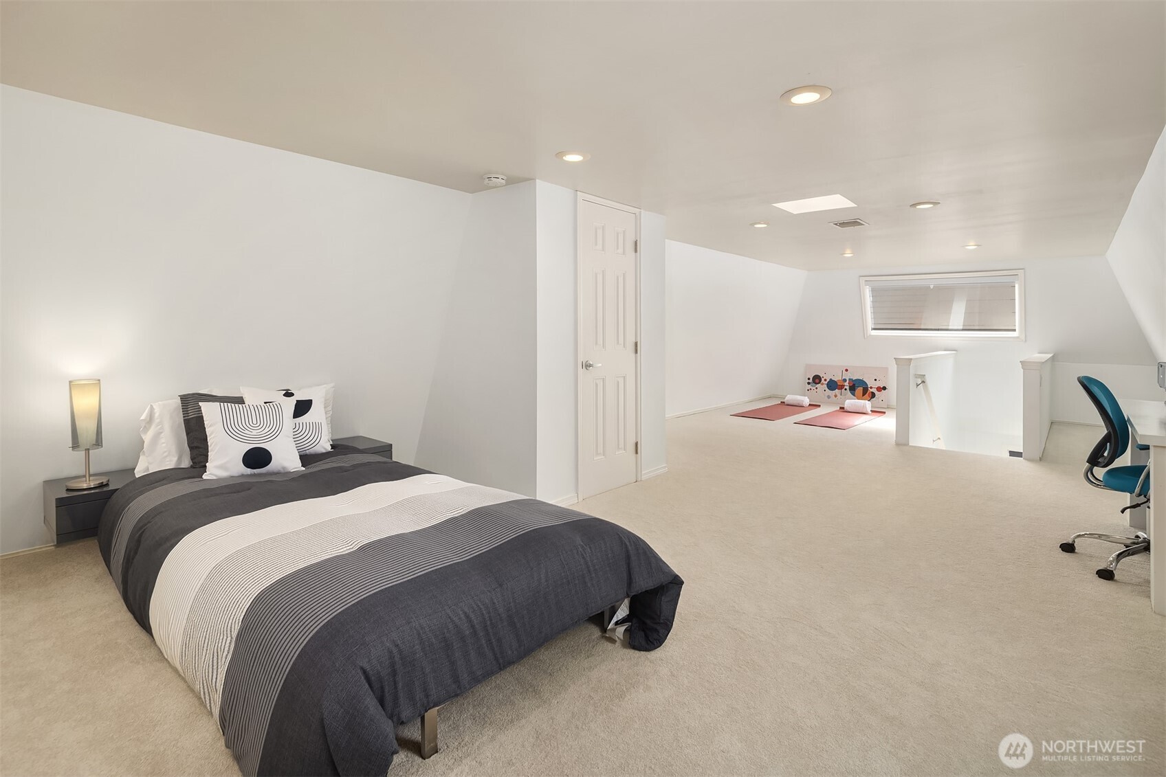 379 100th Avenue Northeast, Unit A Bellevue, WA 98004 - Photo 23 of 38 a bedroom with a bed and a furniture