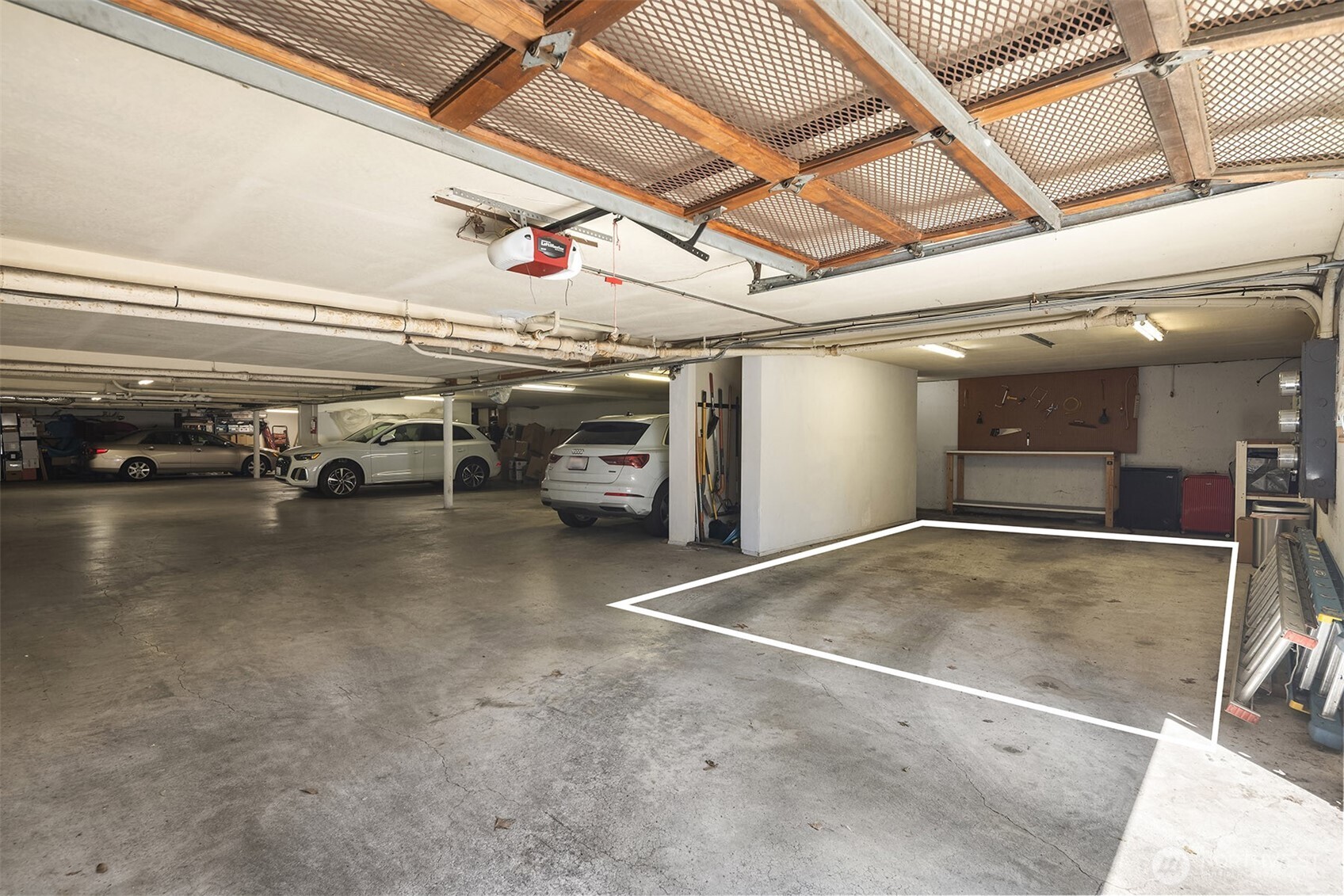 379 100th Avenue Northeast, Unit A Bellevue, WA 98004 - Photo 31 of 38 a view of parking garage with cars