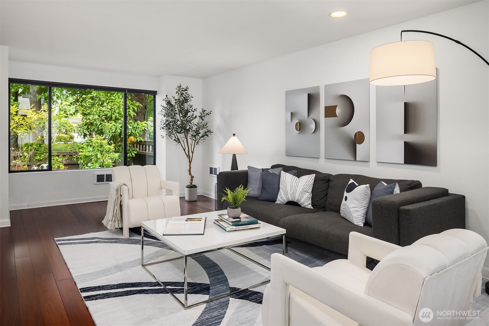 379 100th Avenue Northeast, Unit A Bellevue, WA 98004 - Photo 5 of 38 a living room with furniture and a large window