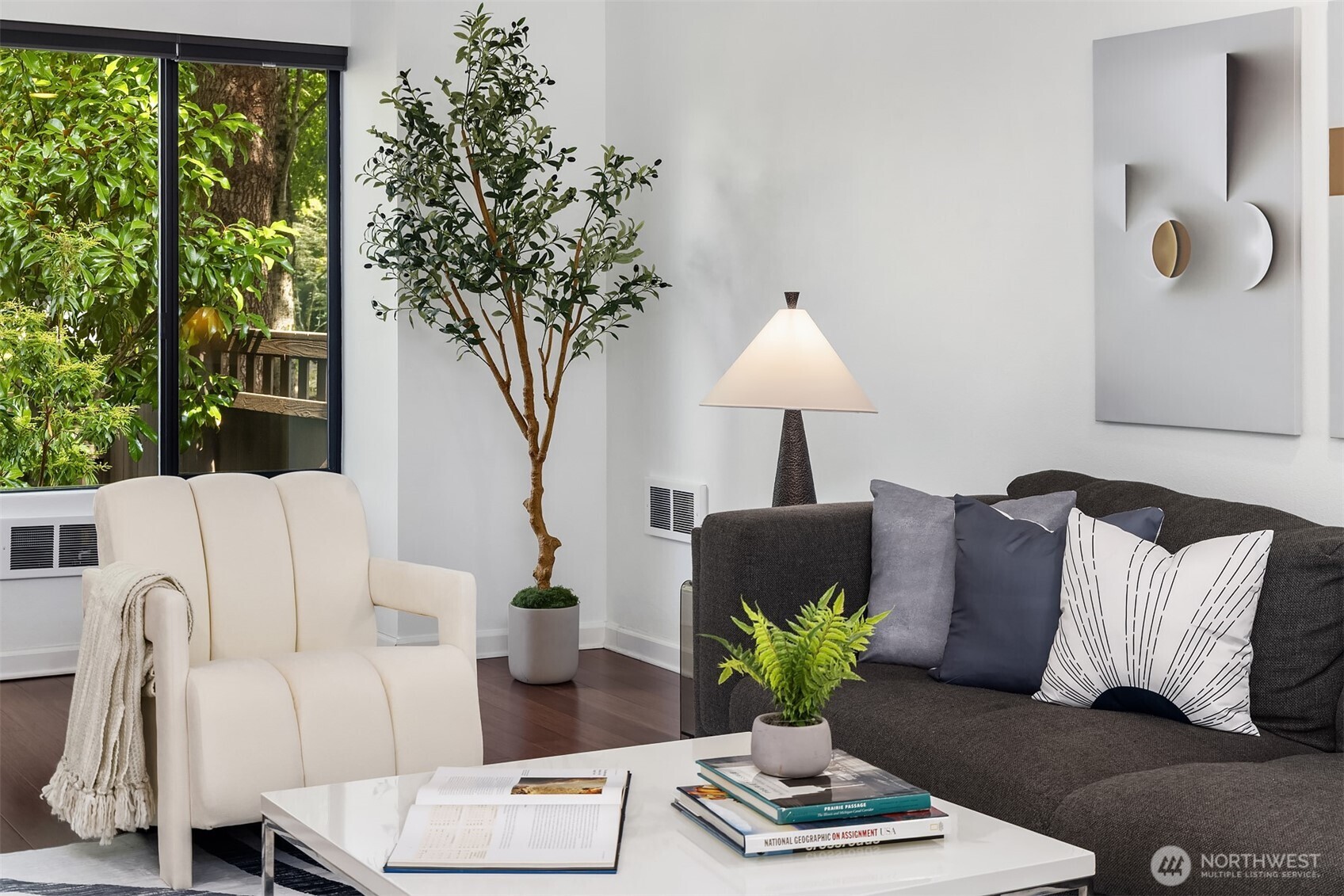 379 100th Avenue Northeast, Unit A Bellevue, WA 98004 - Photo 6 of 38 a living room with furniture and a potted plant