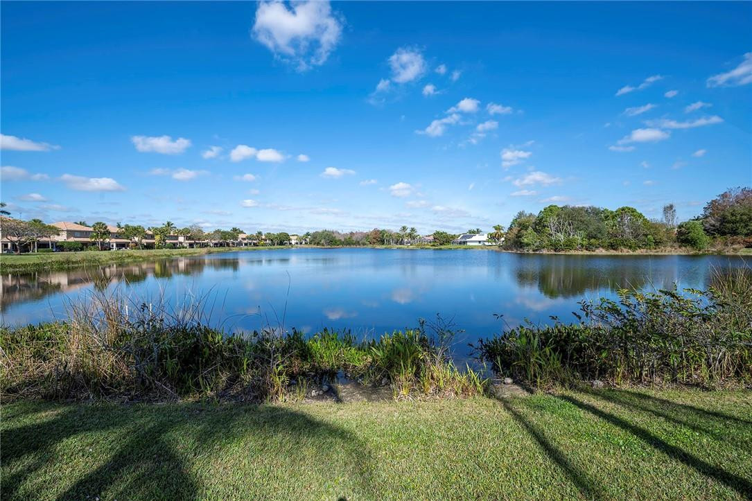 6960 Brook Hollow Road Lake Worth, FL 33467 - Photo 18 of 24 a view of a lake with houses in the back