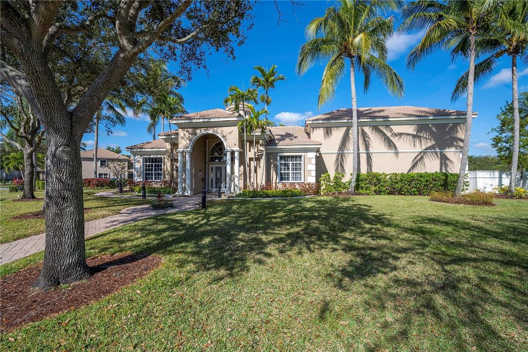 6960 Brook Hollow Road Lake Worth, FL 33467 - Photo 19 of 24 a view of a house with a yard
