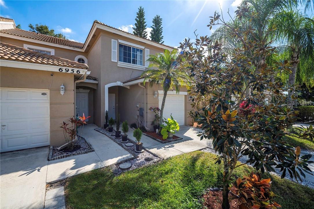 6960 Brook Hollow Road Lake Worth, FL 33467 - Photo 20 of 24 a view of a house with a yard