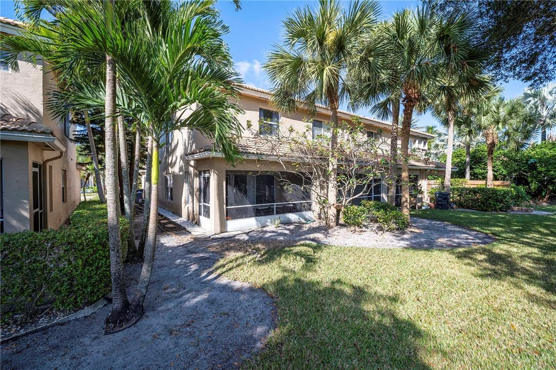 6960 Brook Hollow Road Lake Worth, FL 33467 - Photo 23 of 24 a view of a house with backyard and sitting area