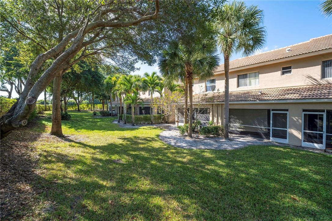 6960 Brook Hollow Road Lake Worth, FL 33467 - Photo 24 of 24 a view of a house with a yard and sitting area