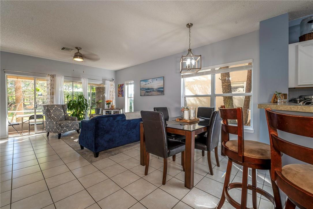 6960 Brook Hollow Road Lake Worth, FL 33467 - Photo 4 of 24 a view of a dining room with furniture