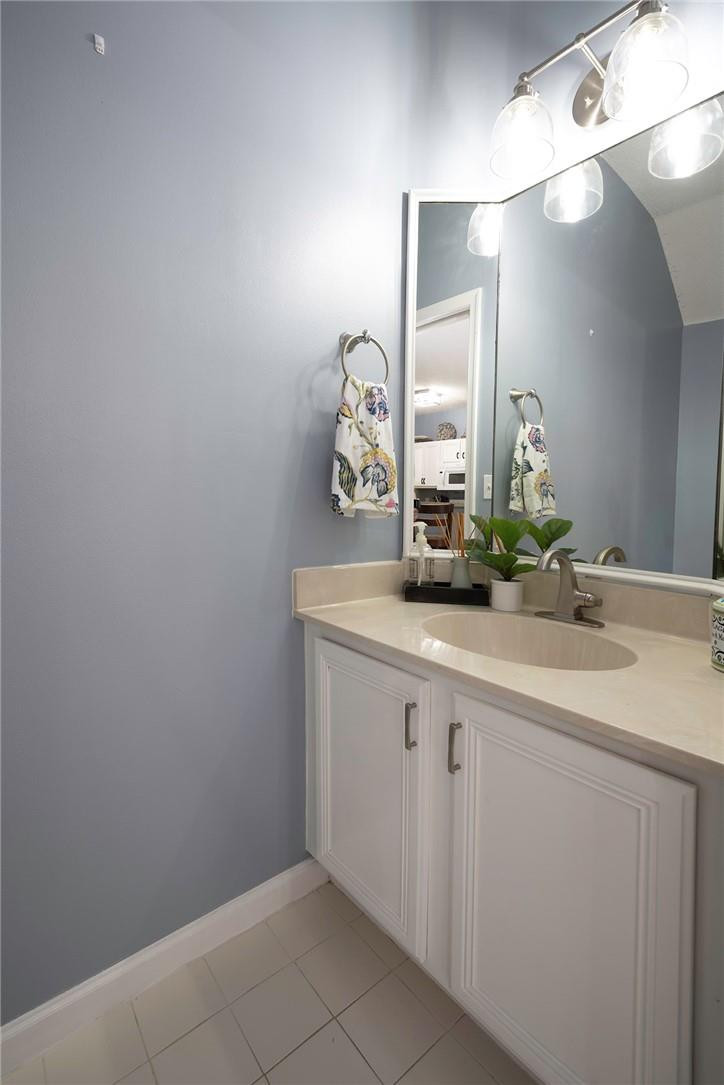 6960 Brook Hollow Road Lake Worth, FL 33467 - Photo 5 of 24 a bathroom with a sink and a mirror