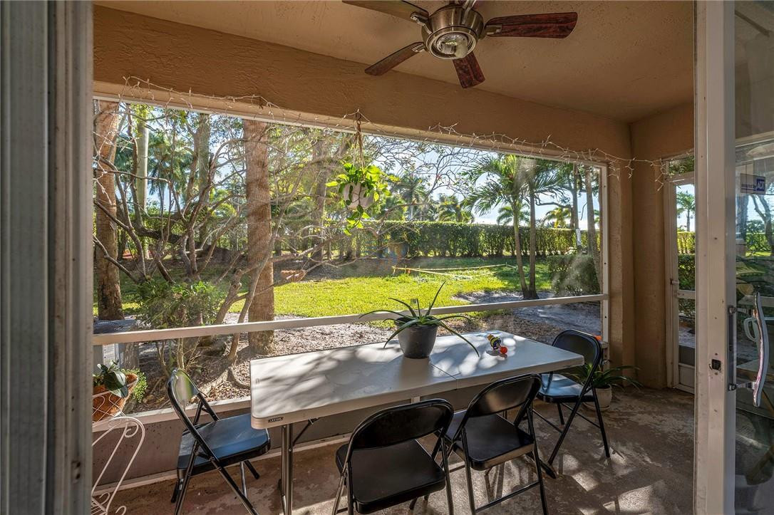 6960 Brook Hollow Road Lake Worth, FL 33467 - Photo 8 of 24 a view of a dining room with furniture window and outside view