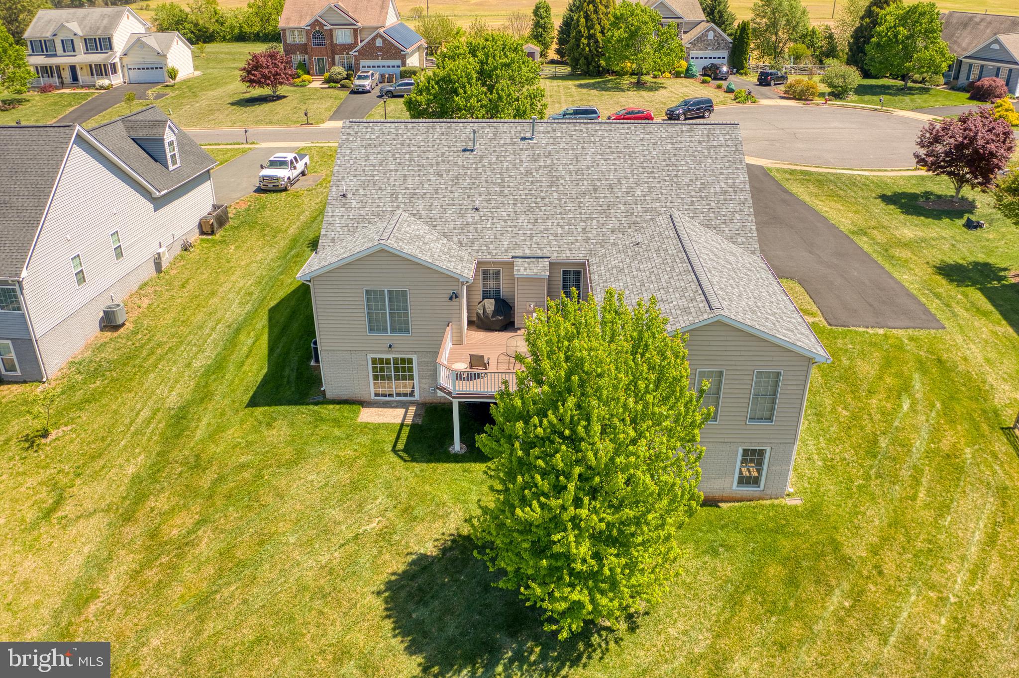 14308 South Hall Court Culpeper, VA 22701 - Photo 62 of 78 an aerial view of a house with swimming pool and large trees