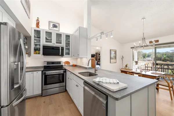 a kitchen with a stove and a microwave