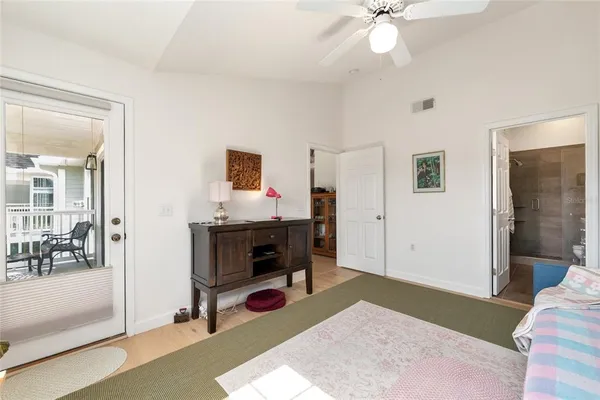 a bathroom with a granite countertop sink mirror and bathtub