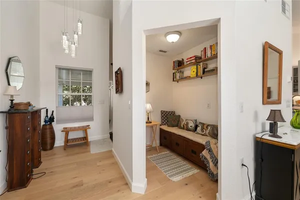 a living room with furniture fireplace and a window