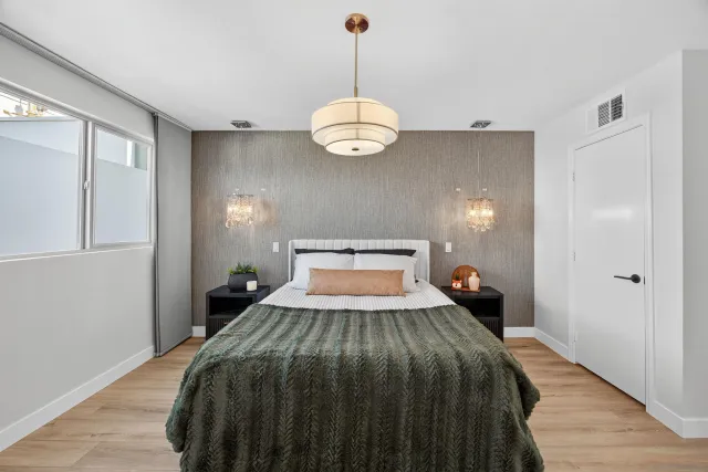 a view of a livingroom with furniture and wooden floor