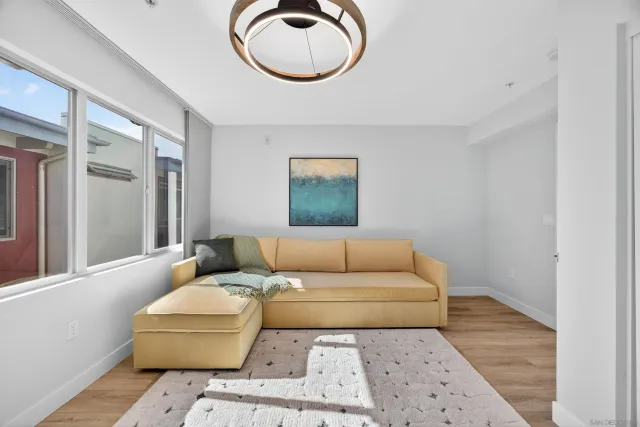 a living room with furniture and a window