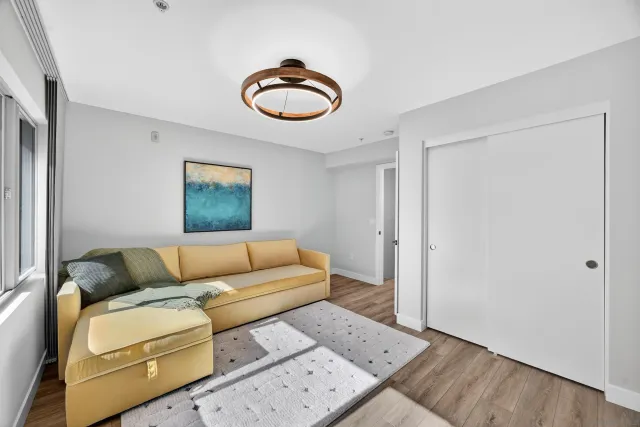 a bedroom with a bed and a couch