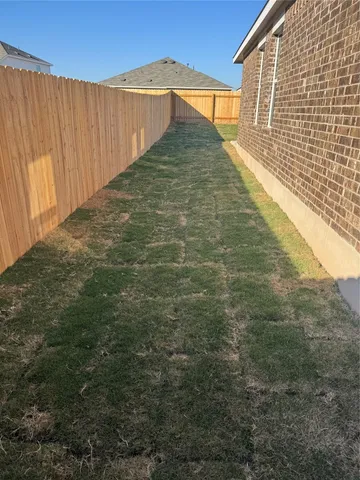 a view of a large yard with an outdoor space