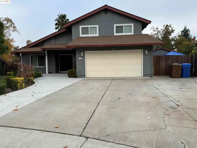 a front view of a house with a garage