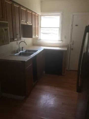 a kitchen with a sink and a window