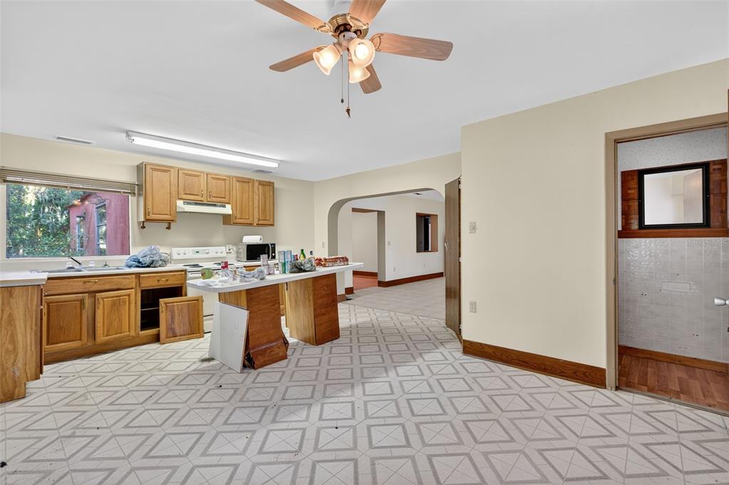 6346 Lost Trail Holiday, FL 34690 - Photo 18 of 55 a large kitchen with a stove a sink dishwasher and a refrigerator