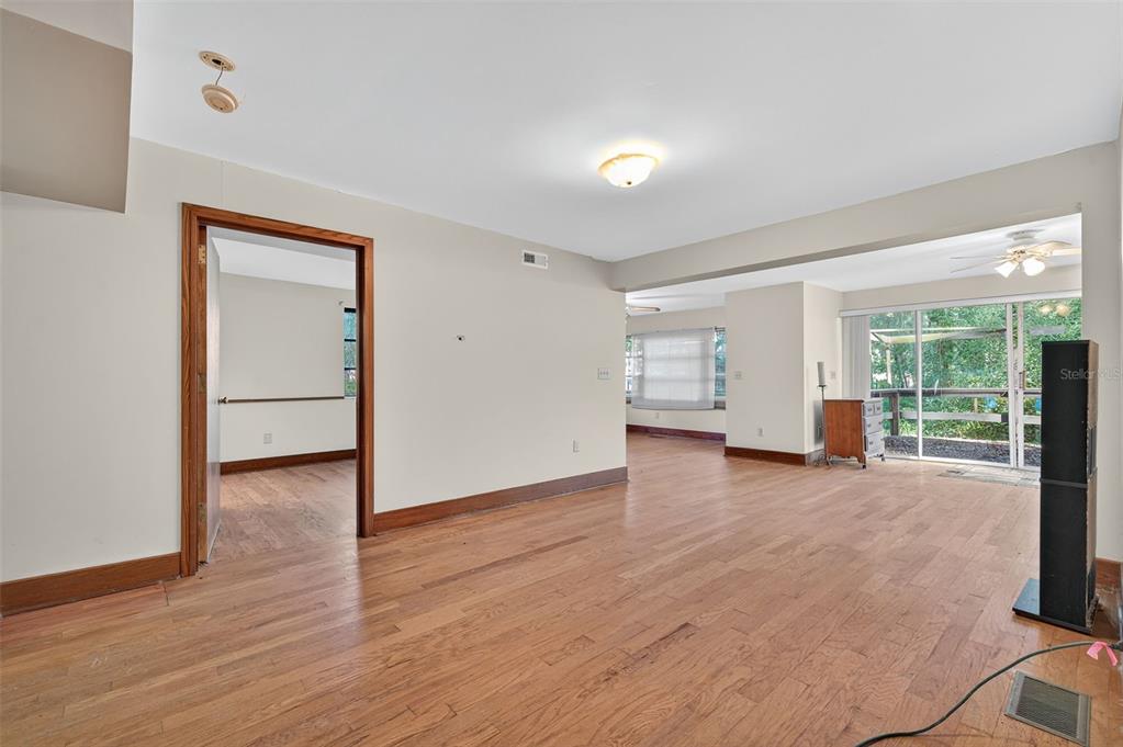 6346 Lost Trail Holiday, FL 34690 - Photo 26 of 55 an empty room with wooden floor and windows