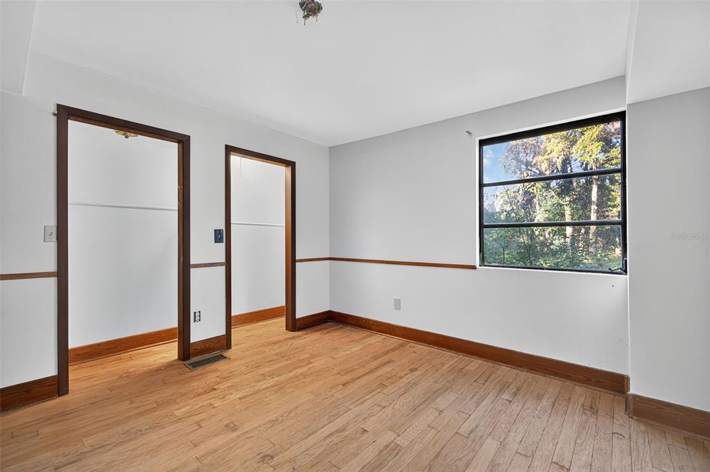 6346 Lost Trail Holiday, FL 34690 - Photo 30 of 55 an empty room with wooden floor and windows