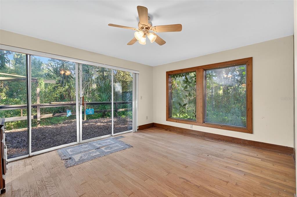 6346 Lost Trail Holiday, FL 34690 - Photo 31 of 55 a view of empty room with wooden floor and fan