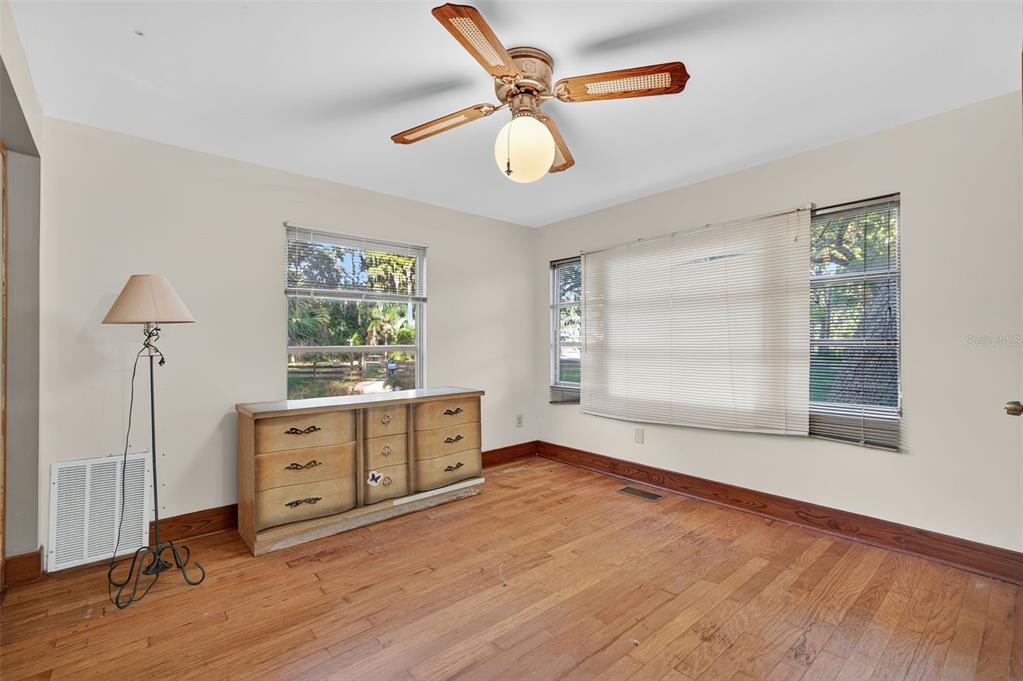 6346 Lost Trail Holiday, FL 34690 - Photo 34 of 55 wooden floor in an empty room with a window