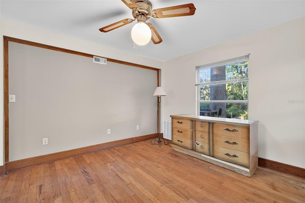 6346 Lost Trail Holiday, FL 34690 - Photo 35 of 55 a view of an empty room with a window and wooden floor