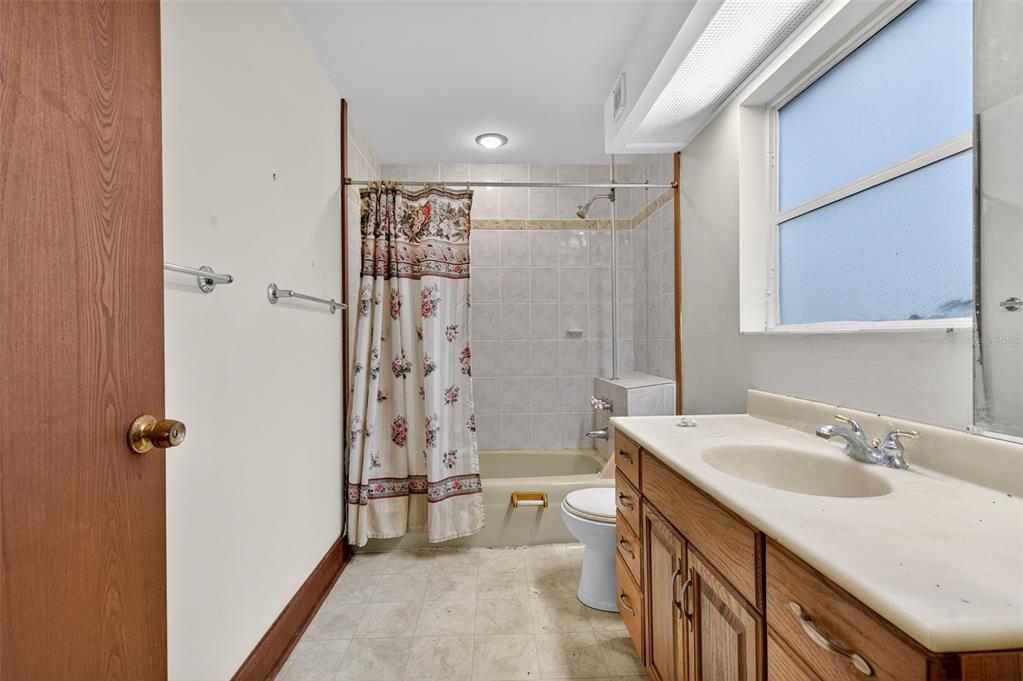 6346 Lost Trail Holiday, FL 34690 - Photo 38 of 55 a bathroom with a sink a toilet and shower