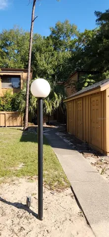a view of a backyard with mountain view and a ocean view
