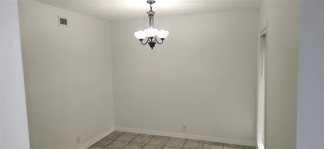 an empty room with white walls