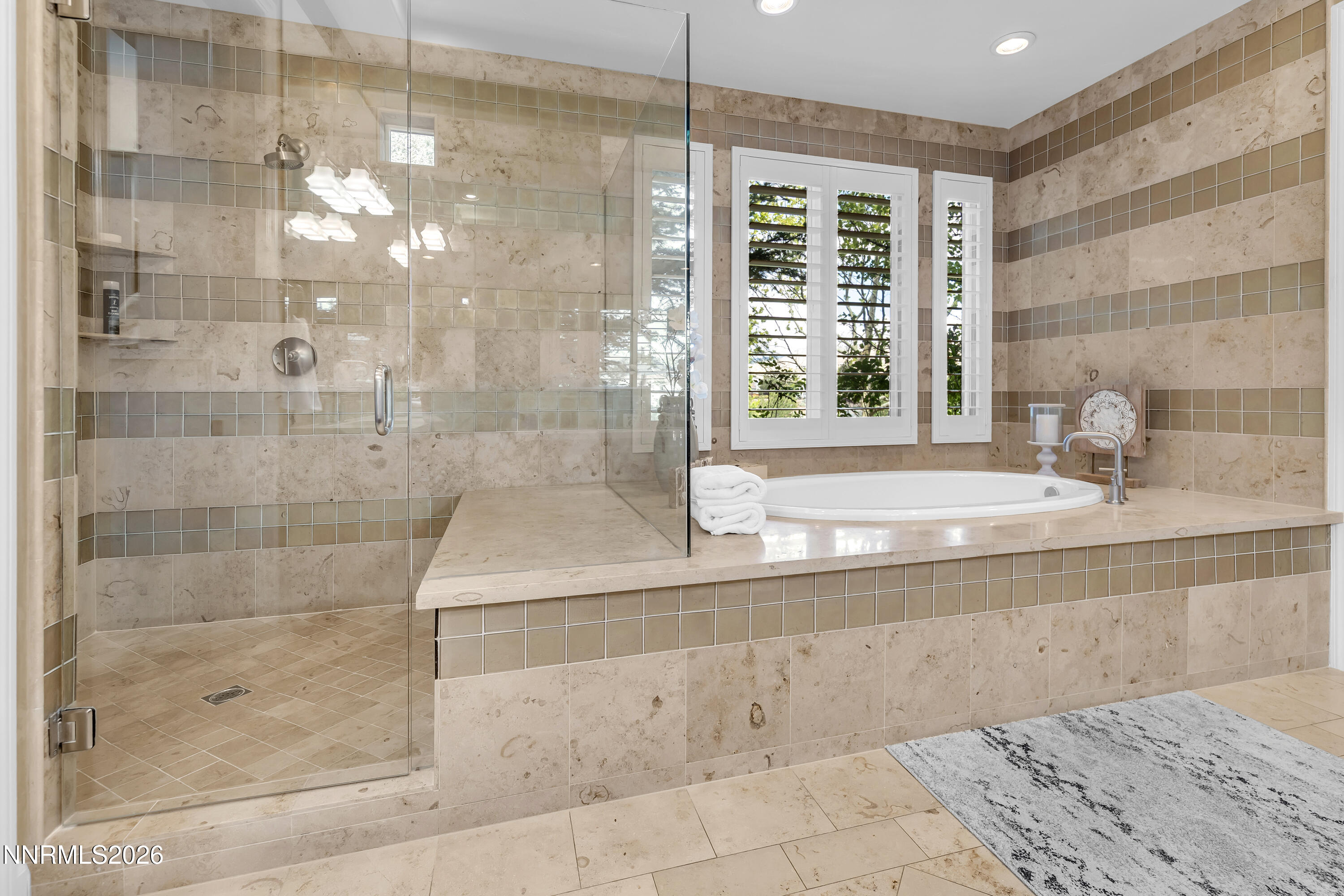 1898 Laurel Ridge Drive Reno, NV 89523 - Photo 11 of 87 a bathroom with a bathtub and a shower