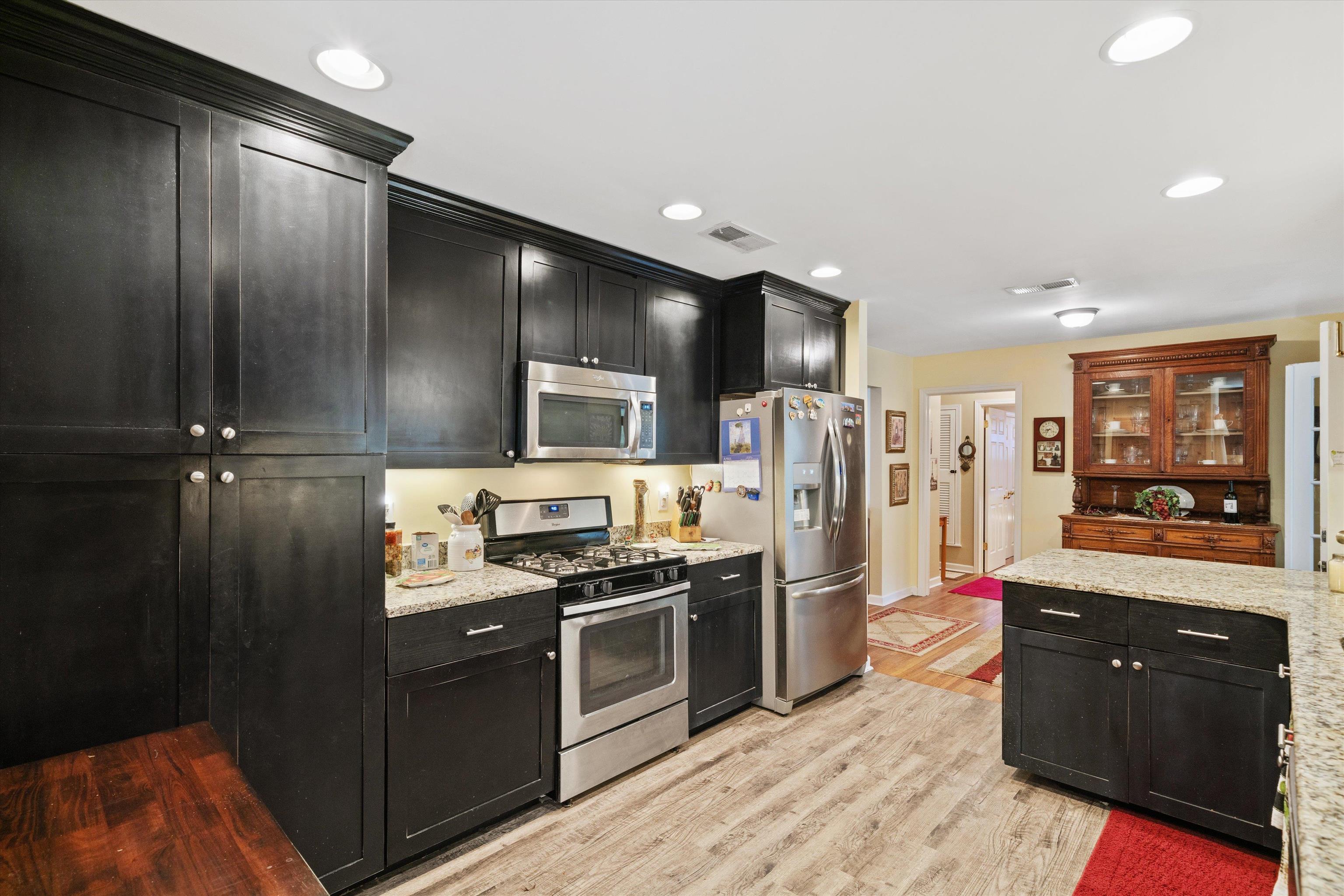 5100 Helene Road Memphis, TN 38117 - Photo 14 of 25 a kitchen with stainless steel appliances granite countertop a refrigerator and a stove top oven