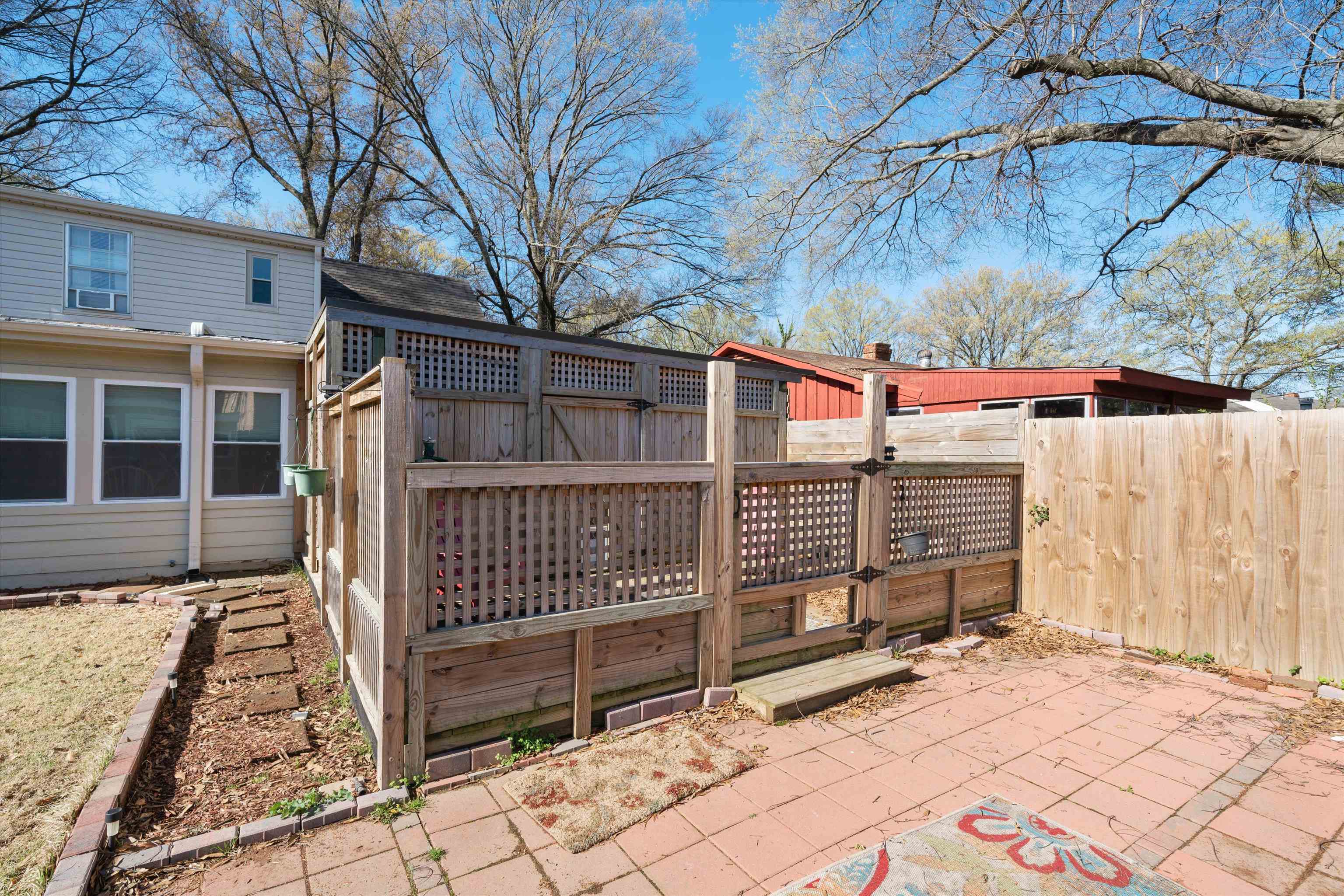 5100 Helene Road Memphis, TN 38117 - Photo 23 of 25 a view of a house with a yard and wooden fence