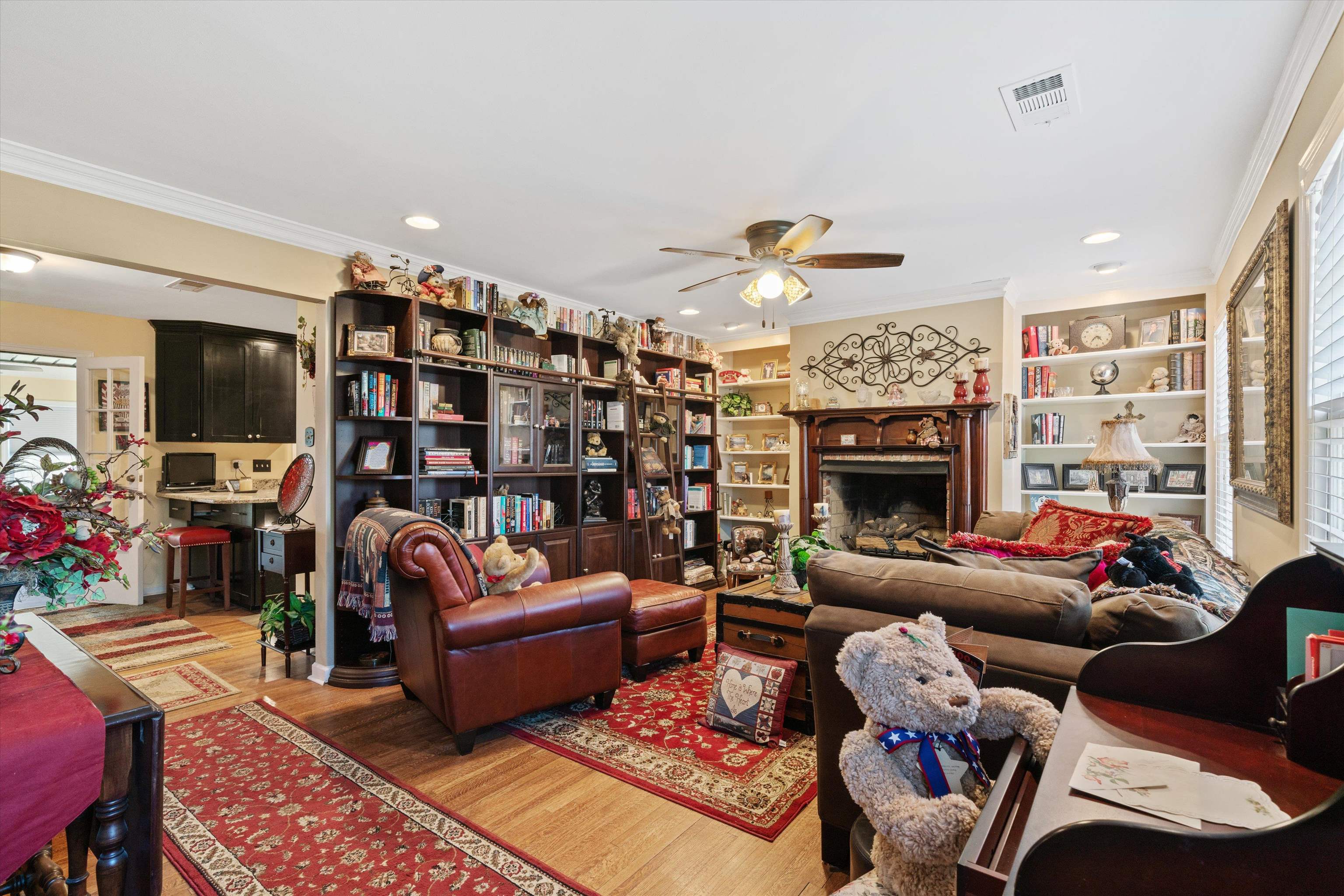 5100 Helene Road Memphis, TN 38117 - Photo 5 of 25 a living room with furniture a fireplace and a flat screen tv