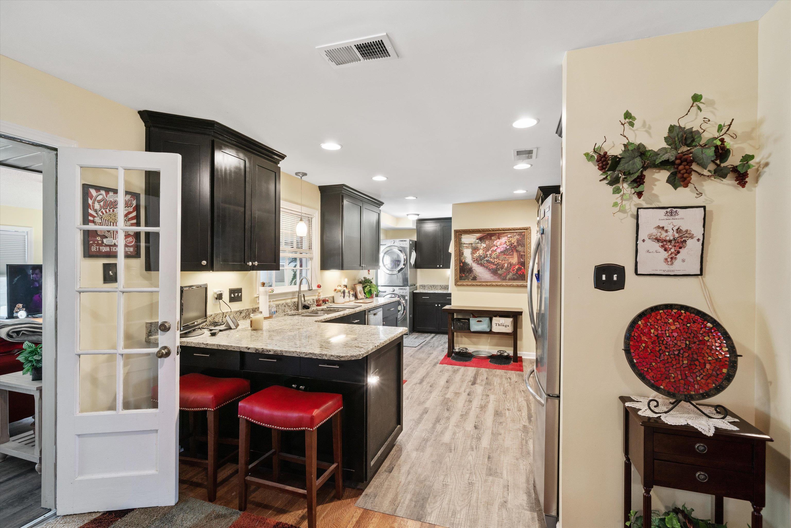 5100 Helene Road Memphis, TN 38117 - Photo 10 of 25 a view of kitchen island dining table and chairs