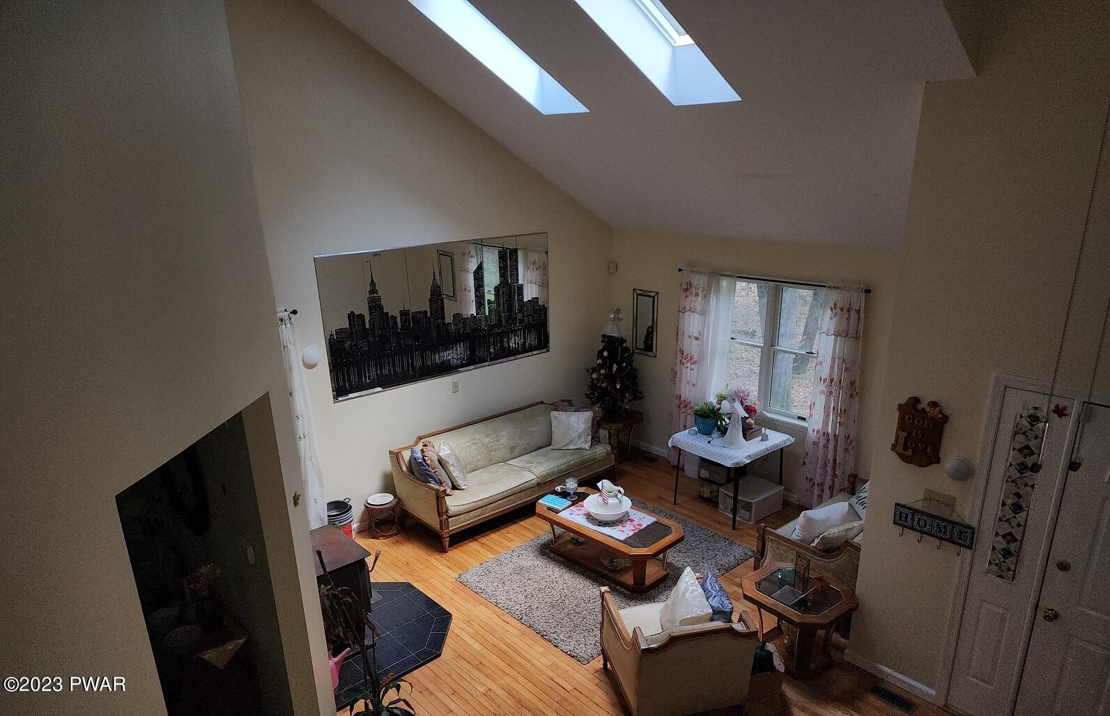 249 Pin Oak Road Stroudsburg, PA 18360 - Photo 5 of 34 a living room with furniture and a flat screen tv
