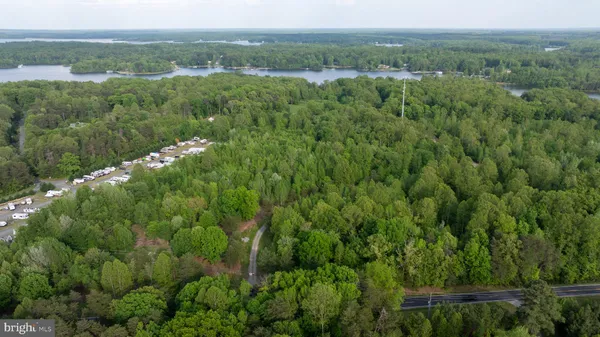 a view of a green field with lots of bushes