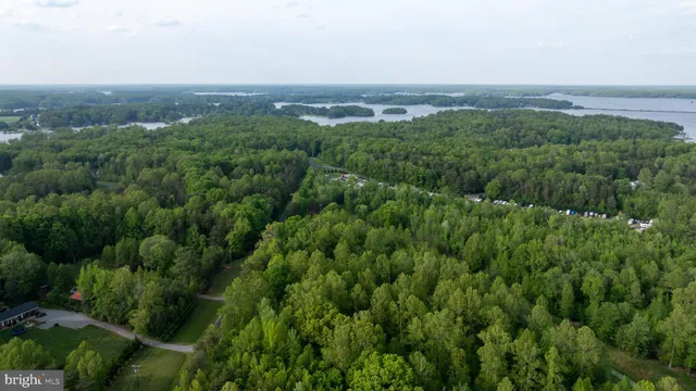 an aerial view of residential houses with outdoor and green space